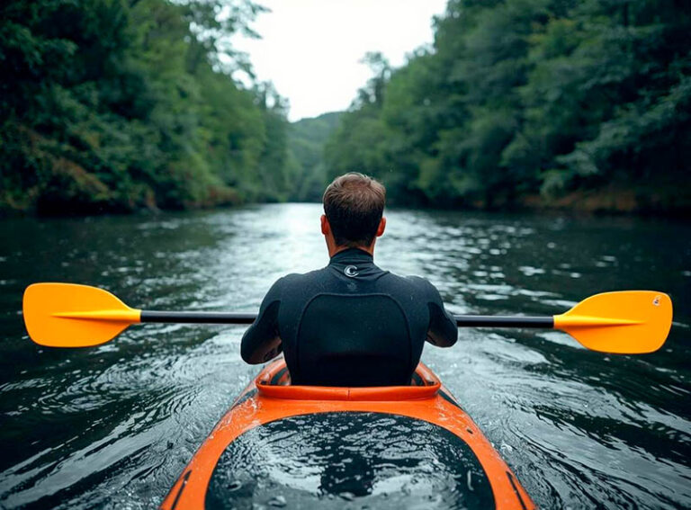 Man kayaking on a river
